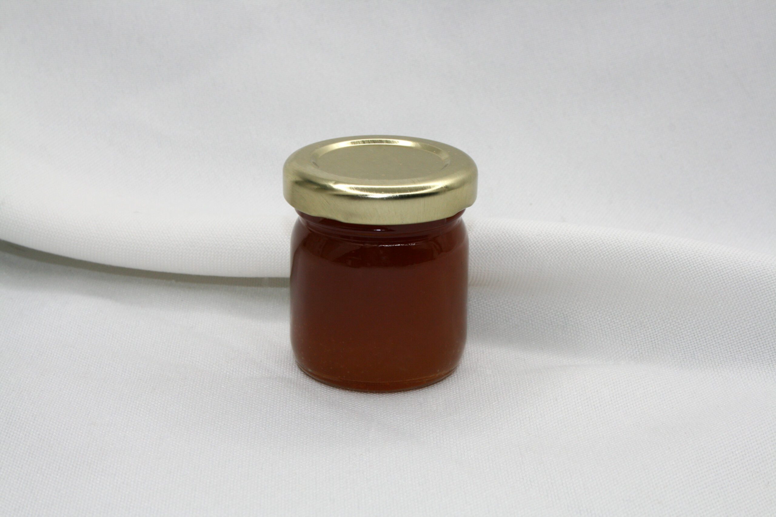 1.5 oz jar of Bushel of Apples Jelly