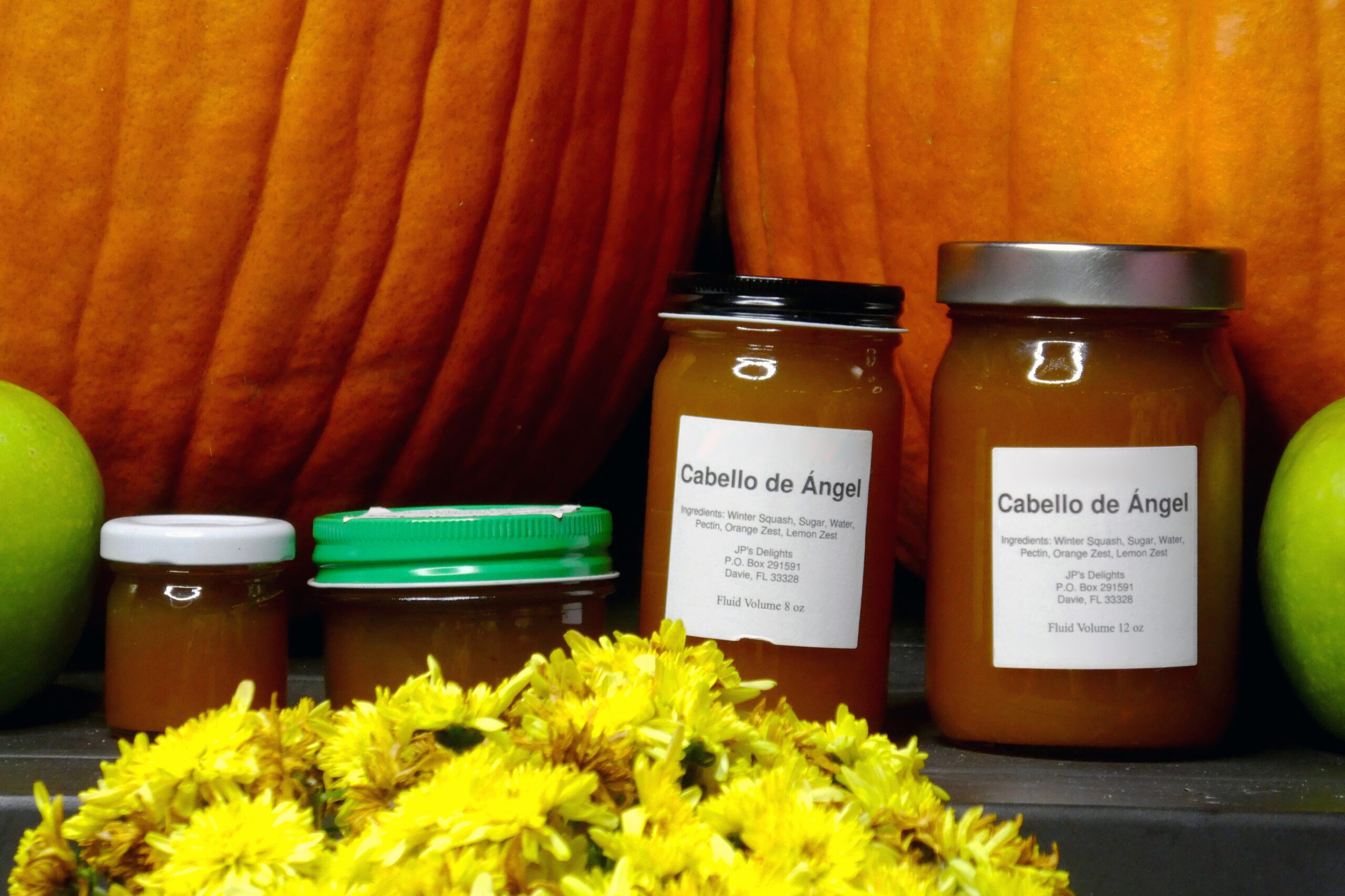 All size jars of Cabello de Angel in a fall setting close up