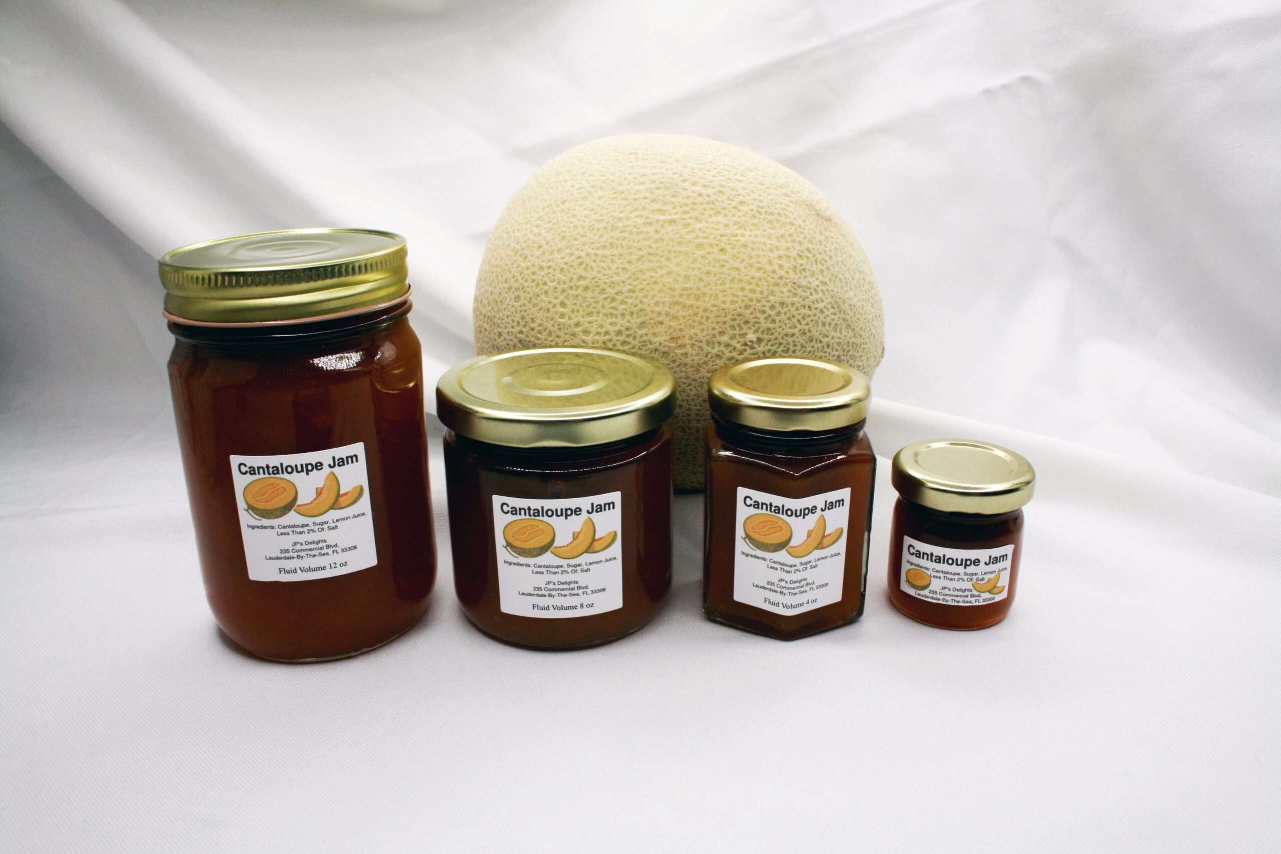 All size jars of Cantaloupe Jam surrounded by its ingredients