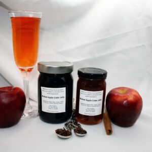 8 and 12 oz jars of Apple Cider Jelly surrounded by their ingredients