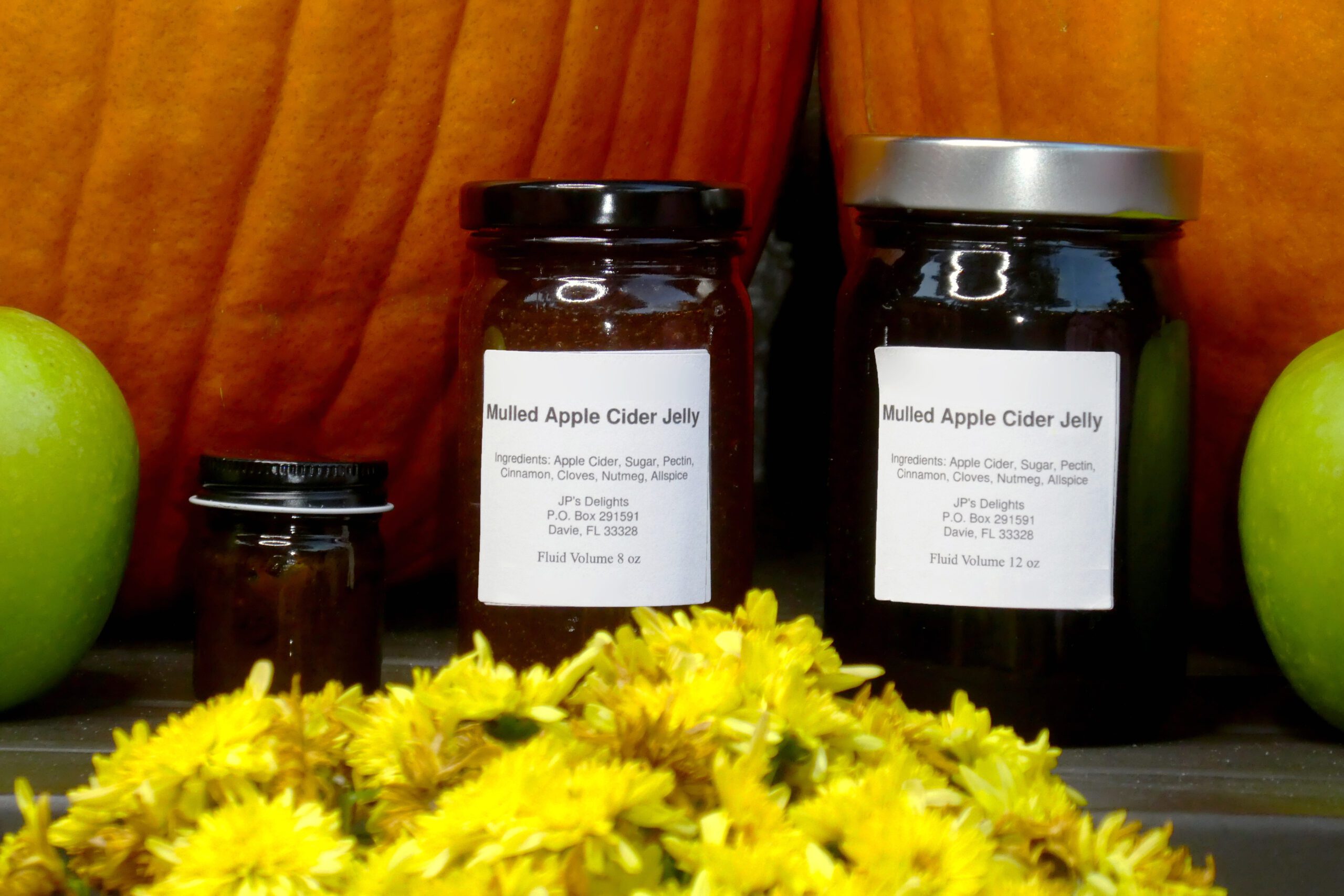 Jars of Apple Cider Jelly close up with a fall theme