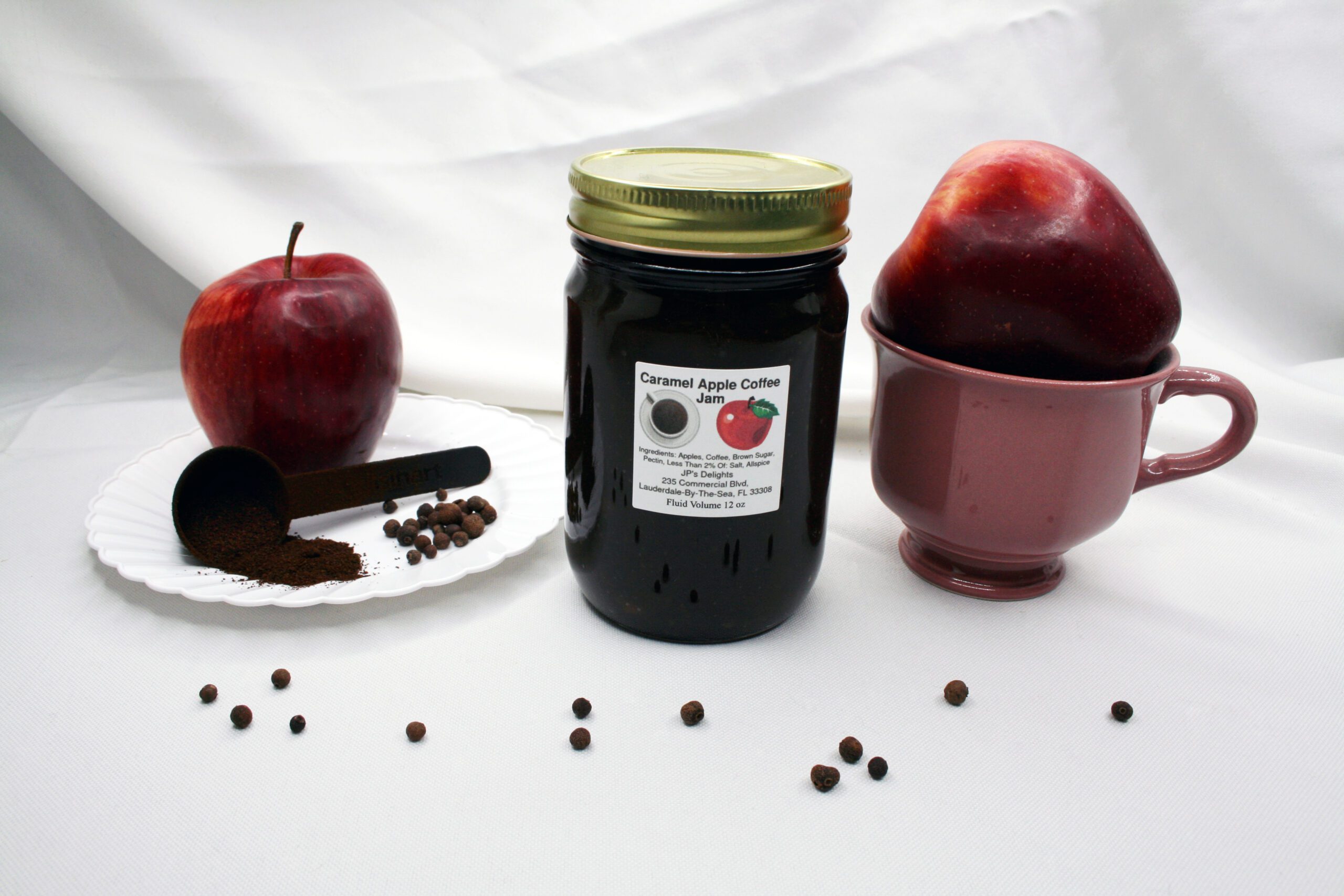 12 oz jar of Caramel Apple Coffee Jam surrounded by its ingredients
